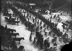 The Tour de France passing through a town in 1906